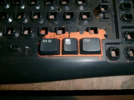 test of putting keys into keyboard with sand beneath them