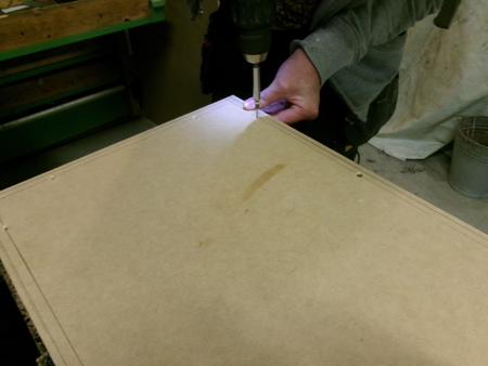 screwing a board to the box