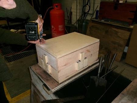 screwing a board to the box
