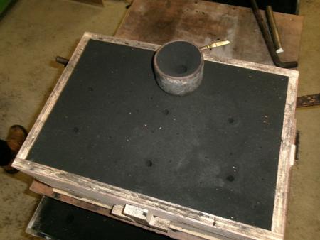 a pouring cup on top of the mold