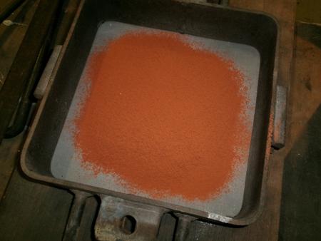 keys buried in orange, oily sand