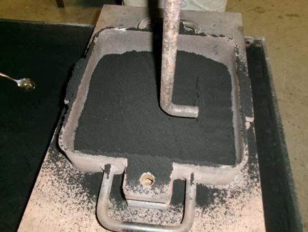 compacting sand with bar